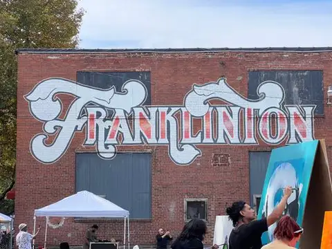 Franklinton's spirit shines bright under its iconic mural.